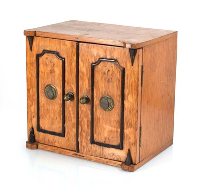 Lot 107 - An early 20th century oak table cabinet in the...