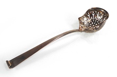 Lot 412 - A Victorian silver sifting spoon, maker JTH...