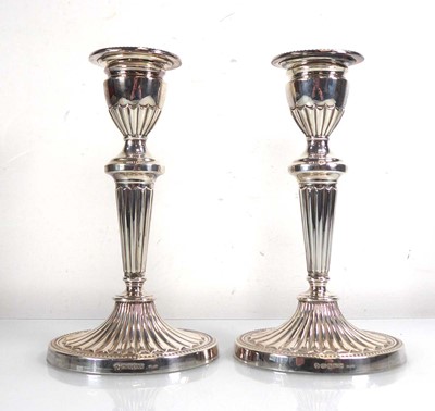 Lot 426 - A pair of silver candlesticks of typical...