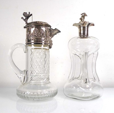 Lot 437 - An early 20th century claret jug with silver...