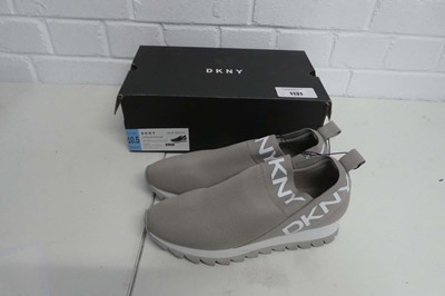 Lot 1131 - A boxed pair of DKNY slip on trainers in warm...