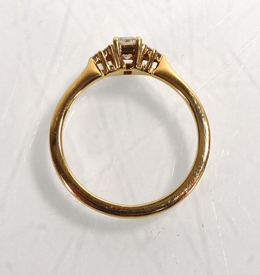 Lot A yellow metal ring set rectangular cut...