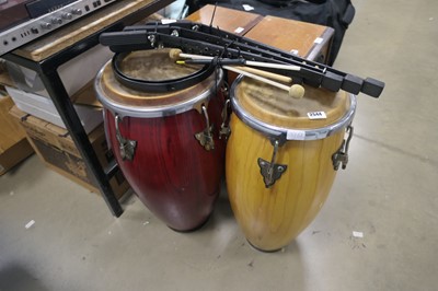 Lot 2544 - Pair of conga drums with stands and sticks