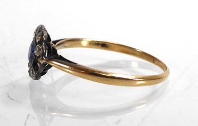 Lot 800 - A yellow metal cluster ring set synthetic...