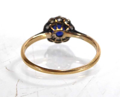 Lot 800 - A yellow metal cluster ring set synthetic...