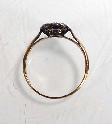 Lot 800 - A yellow metal cluster ring set synthetic...