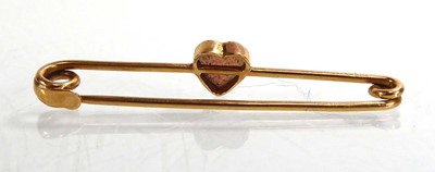 Lot A yellow metal bar brooch set heart shaped...