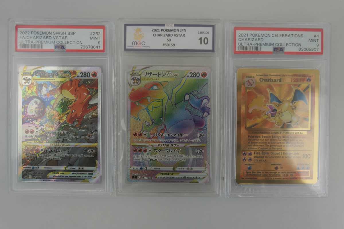 Lot 3 graded Charizard Pokémon cards to include...