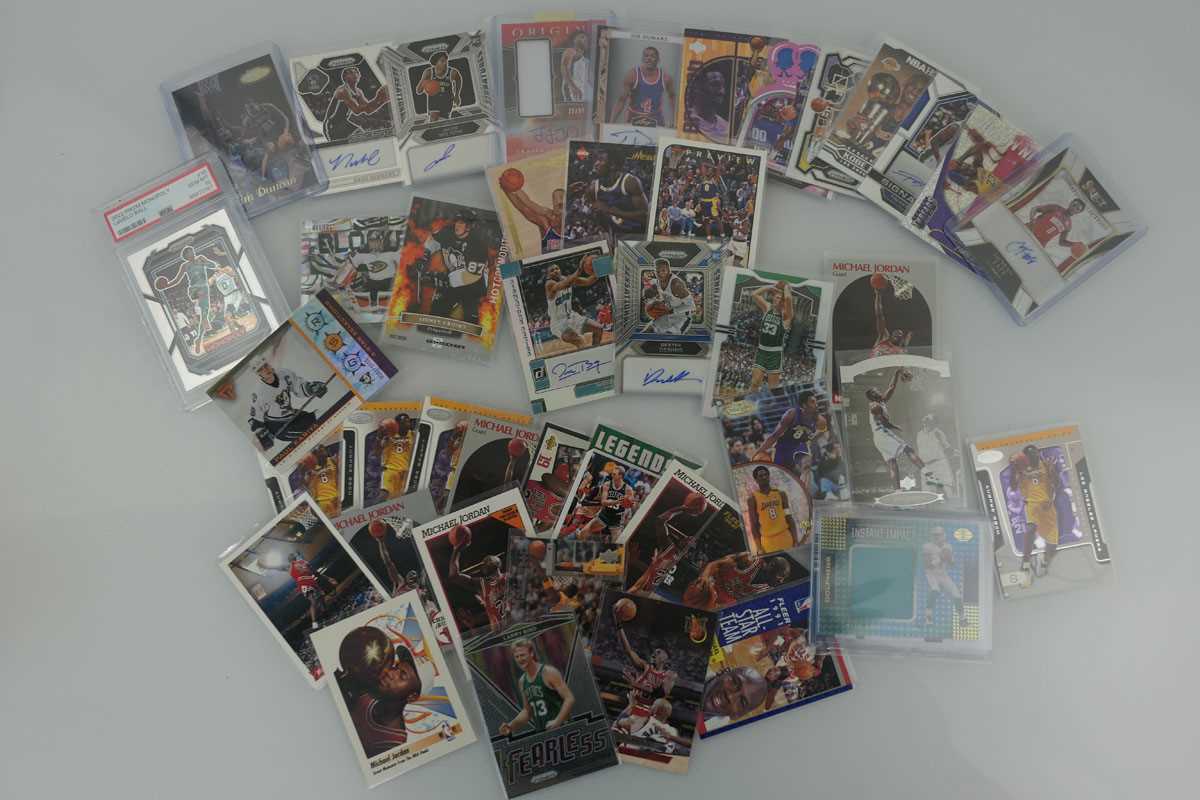 Lot An assortment of sports trading cards to...