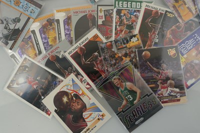 Lot An assortment of sports trading cards to...