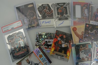 Lot An assortment of sports trading cards to...