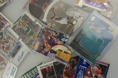 Lot An assortment of sports trading cards to...