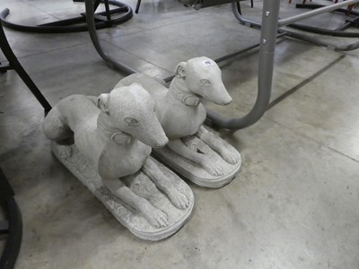 Lot 2125 - Pair of concrete lying down dogs