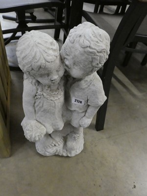 Lot 2128 - Concrete boy kissing girl holding flowers