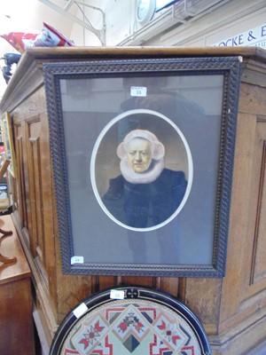 Lot 16 - A framed and glazed oval print of an elderly...