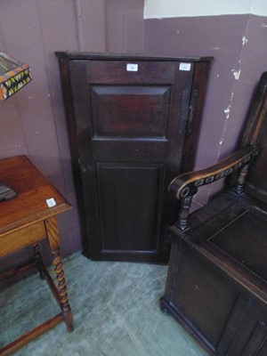 Lot 34 - A 19th century oak wall mounted corner cabinet...