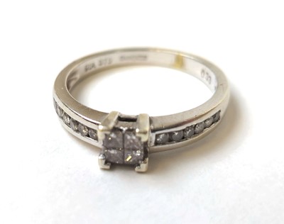 Lot 502 - A 9ct white gold and diamond ring, the four...