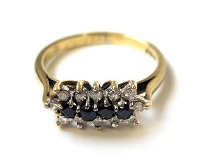 Lot 505 - A 9ct gold, sapphire and diamond line set...