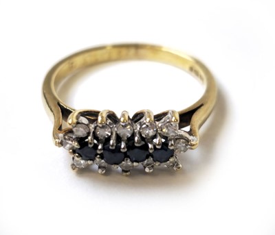 Lot 505 - A 9ct gold, sapphire and diamond line set...