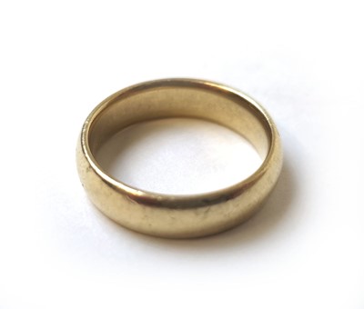 Lot 506 - A yellow metal, court shaped wedding band...