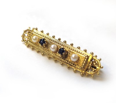 Lot 513 - A 9ct gold, sapphire and pearl set bar brooch....