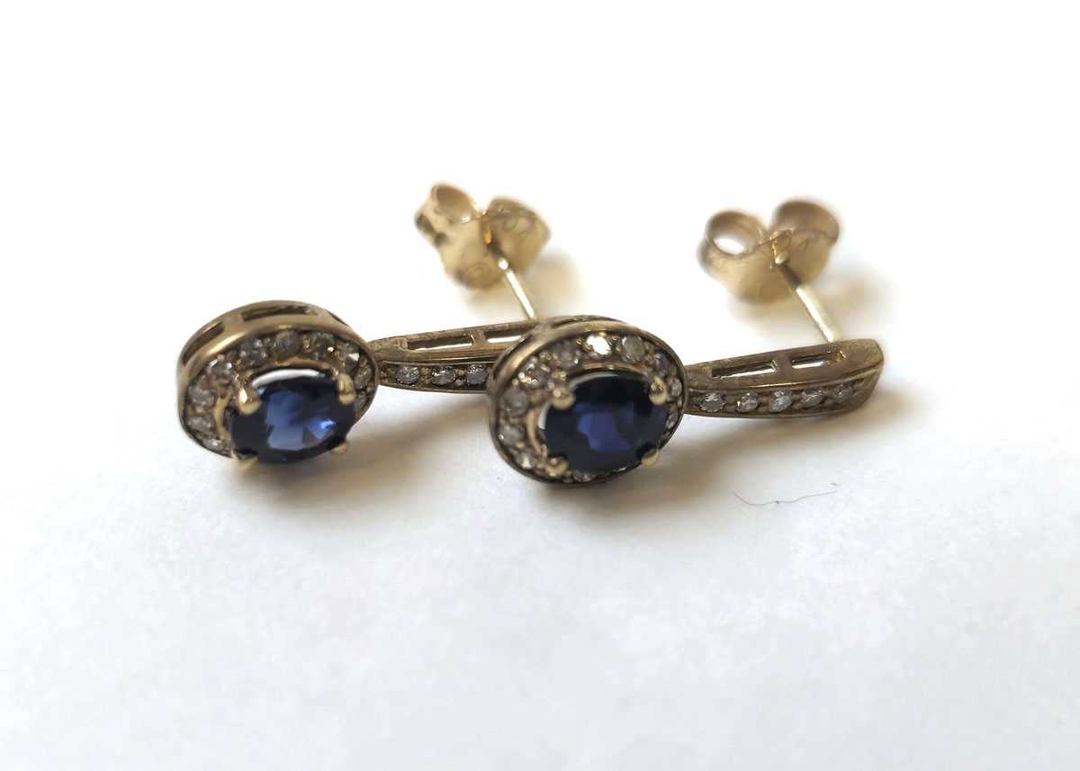 Lot 521 - A pair of 9ct gold, sapphire and diamond...