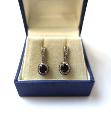 Lot 521 - A pair of 9ct gold, sapphire and diamond...