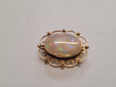 Lot 524 - An early 20th century yellow metal, opal and...