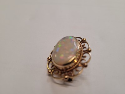 Lot 524 - An early 20th century yellow metal, opal and...