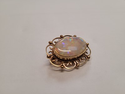 Lot 524 - An early 20th century yellow metal, opal and...