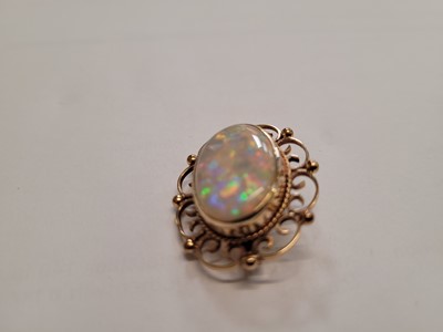 Lot 524 - An early 20th century yellow metal, opal and...