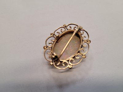 Lot 524 - An early 20th century yellow metal, opal and...