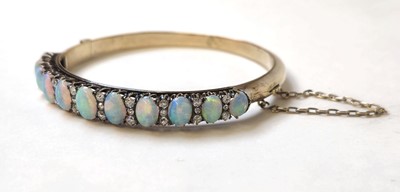 Lot 524 - An early 20th century yellow metal, opal and...