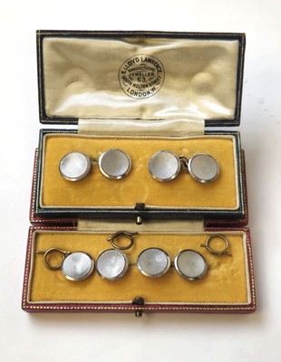 Lot 525 - A boxed pair of cufflinks marked '9ct & pt'...