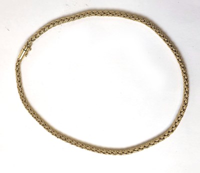 Lot 527 - A yellow metal braided link chain marked...