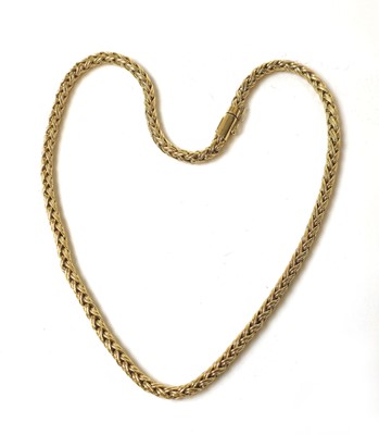 Lot 527 - A yellow metal braided link chain marked...