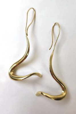 Lot 535 - Two oversized yellow metal earrings marked...