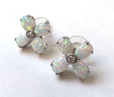 Lot 544 - A pair of white metal, opal and white stone...