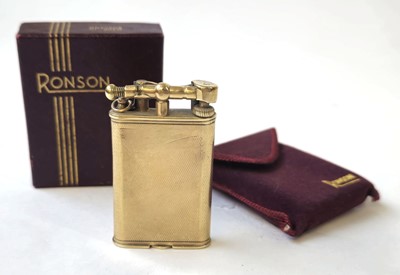 Lot 560 - A 9ct gold Dunhill arm lift lighter....