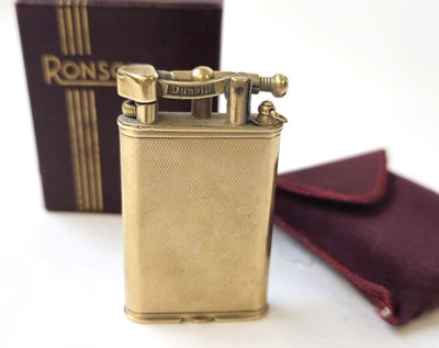 Lot 560 - A 9ct gold Dunhill arm lift lighter....