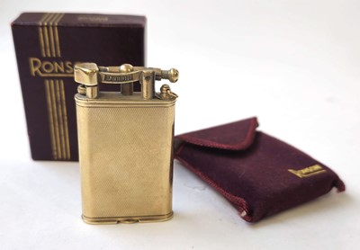 Lot 560 - A 9ct gold Dunhill arm lift lighter....