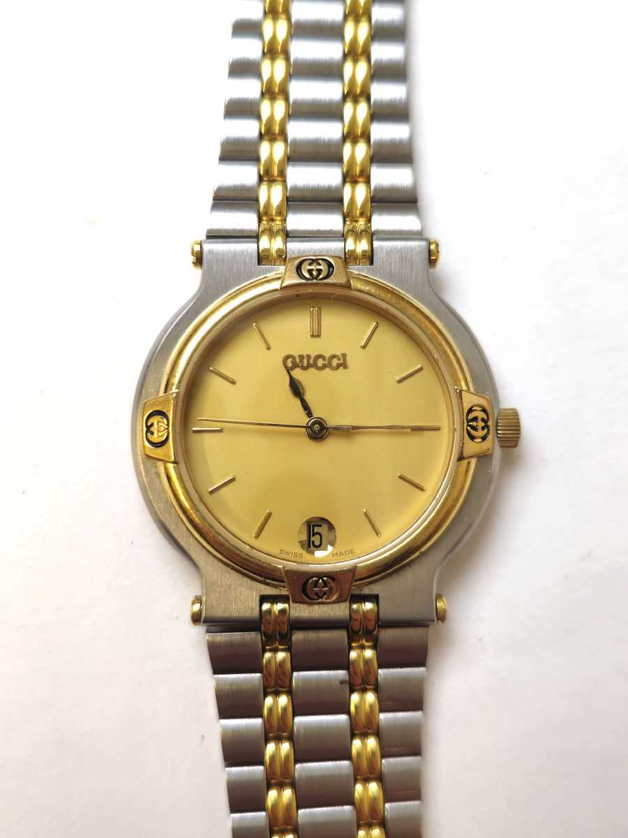 Lot 569 - A Gucci 9000M two-tone quartz wristwatch with box