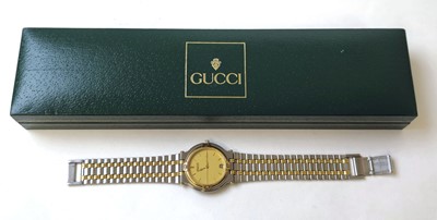 Lot 569 - A Gucci 9000M two-tone quartz wristwatch with box