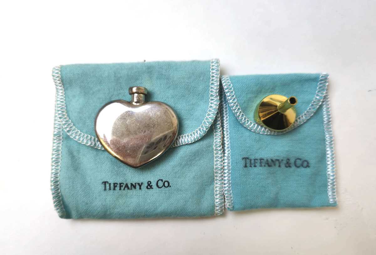 Lot 552 - A Tiffany & Co. white metal heart shaped scent...