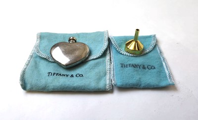 Lot 552 - A Tiffany & Co. white metal heart shaped scent...