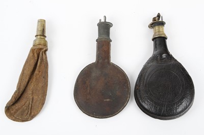 Lot 5 - Three leather shot flasks: two circular with...