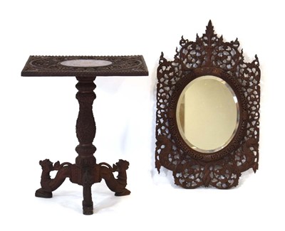 Lot 35 - A carved fretwork table in the South East...