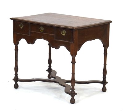 Lot 37 - An 18th century oak writing table or lowboy,...