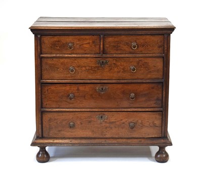 Lot 41 - An 18th century oak chest of two short over...