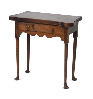 Lot 42 - An 18th century and later oak tea table, the...